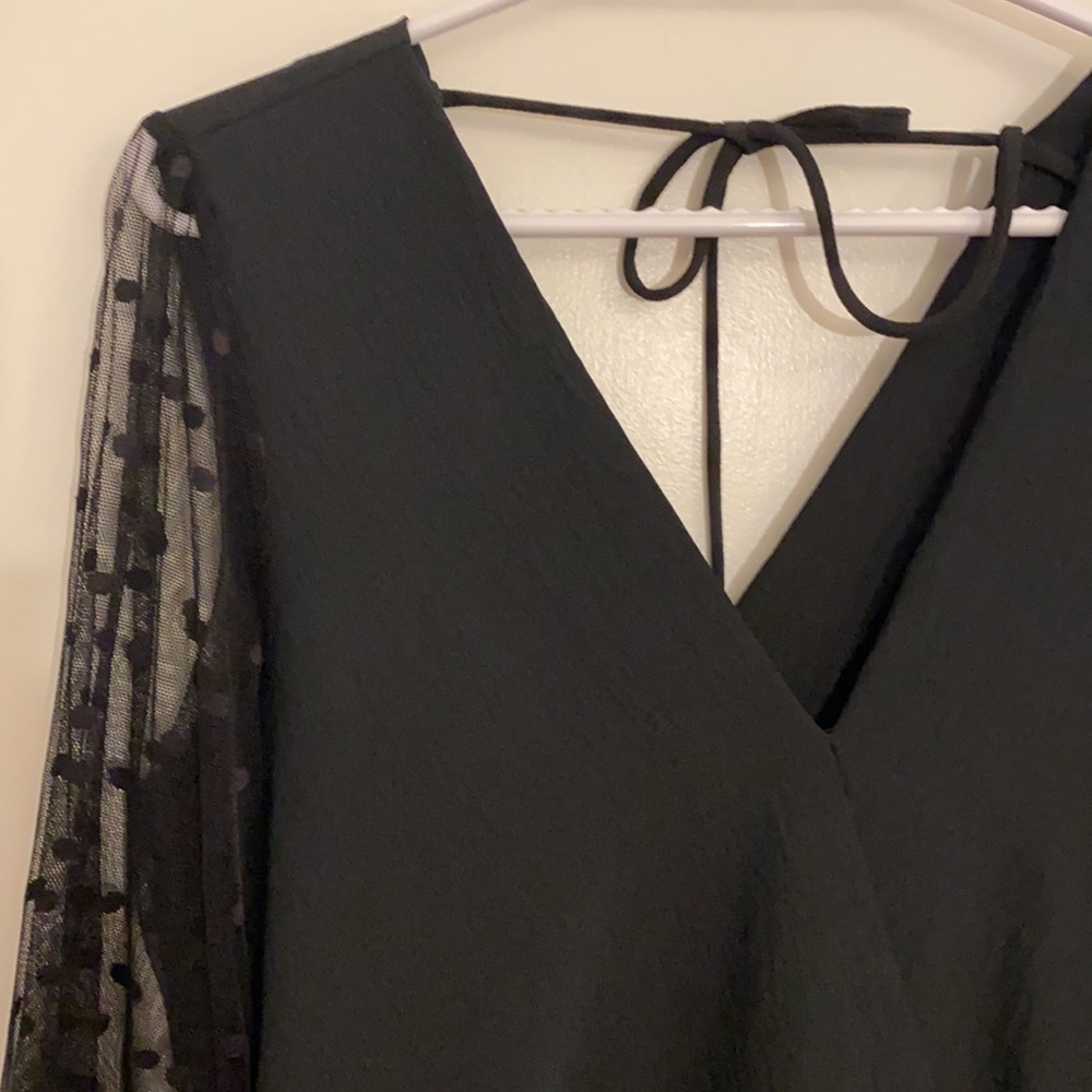 Wrap-style top with mesh lace sleeves